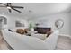 Spacious living room featuring stylish furniture, modern art, and a cozy atmosphere at 2431 Murray Pass, Odessa, FL 33556