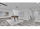 Bright living room featuring a foosball table and stylish decor in a modern space at 2431 Murray Pass, Odessa, FL 33556