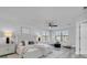 Spacious main bedroom with sitting area, ceiling fan, and neutral decor at 2431 Murray Pass, Odessa, FL 33556