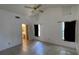 Spacious bedroom with tile flooring, ceiling fan, and en-suite bathroom at 2538 Indigo Dr, Dunedin, FL 34698