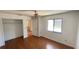 Cozy bedroom with hardwood floors and view of pool area outside window at 2538 Indigo Dr, Dunedin, FL 34698