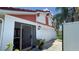 Exterior view of the home's entrance featuring an overhang with decorative lights at 2538 Indigo Dr, Dunedin, FL 34698