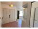Foyer with tile flooring, double doors, and a coat closet with a mirror at 2538 Indigo Dr, Dunedin, FL 34698