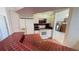 Cozy kitchen featuring vibrant red tile countertops and essential appliances at 2538 Indigo Dr, Dunedin, FL 34698