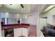 Open concept kitchen features ample cabinet space and adjoining dining area at 2538 Indigo Dr, Dunedin, FL 34698