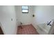 Laundry room with a utility sink and washer dryer hookups with tile floor at 2538 Indigo Dr, Dunedin, FL 34698