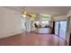 Spacious living area with tile floors, high ceilings, and bright open kitchen at 2538 Indigo Dr, Dunedin, FL 34698