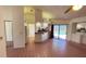 Living room with tile floors, ceiling fan, and access to the pool through sliding glass doors at 2538 Indigo Dr, Dunedin, FL 34698
