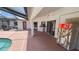 Covered patio area with tile floor, leading to pool and backyard at 2538 Indigo Dr, Dunedin, FL 34698