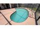 Enjoy this backyard pool with covered lanai and screened enclosure at 2538 Indigo Dr, Dunedin, FL 34698