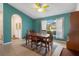 Inviting dining room featuring a wooden table, tiled floors, and a view of the outdoors at 2924 Windridge Dr, Holiday, FL 34691
