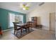 This dining room features an elegant table, neutral walls, and bright light at 2924 Windridge Dr, Holiday, FL 34691