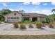 Well-maintained home with a two-car garage and an attractive landscaped front yard at 2924 Windridge Dr, Holiday, FL 34691