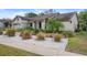 Well-manicured front yard with rock ground cover and lush landscaping at 2924 Windridge Dr, Holiday, FL 34691