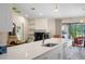 Bright and spacious kitchen featuring a large center island and access to a sitting room at 2924 Windridge Dr, Holiday, FL 34691