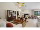 Comfortable living room with fireplace, tile flooring, and classic furnishings in an inviting space at 2924 Windridge Dr, Holiday, FL 34691