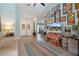 This living room is light and bright with high ceilings and tile flooring throughout at 2924 Windridge Dr, Holiday, FL 34691