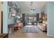 Bright, open living room with tile floors and sliding glass doors leading to the pool at 2924 Windridge Dr, Holiday, FL 34691