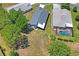 An aerial view showcasing the layout of the home and surrounding greenery at 312 Barrington Ct, Spring Hill, FL 34609