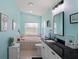 Relax in this bathroom featuring a garden tub, black countertop, and great lighting at 312 Barrington Ct, Spring Hill, FL 34609