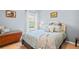 Bedroom featuring a bed with decorative pillows, storage bench and bright natural light at 312 Barrington Ct, Spring Hill, FL 34609
