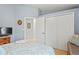 Bedroom featuring a bed with decorative pillows and a large closet at 312 Barrington Ct, Spring Hill, FL 34609
