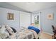 Bright bedroom featuring a comfortable bed, closet and window letting in natural light at 312 Barrington Ct, Spring Hill, FL 34609