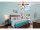Vaulted ceilings and natural light fill this spacious bedroom with wood flooring at 312 Barrington Ct, Spring Hill, FL 34609