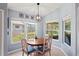 Bright dining area with backyard view and ample natural light at 312 Barrington Ct, Spring Hill, FL 34609