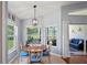 Cozy dining area with views of the backyard and screened patio at 312 Barrington Ct, Spring Hill, FL 34609