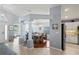 Open-concept dining room with decorative pillars, tile, and wood flooring at 312 Barrington Ct, Spring Hill, FL 34609