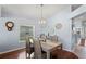 Charming dining room with modern chandelier and decorative wall art at 312 Barrington Ct, Spring Hill, FL 34609