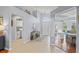 Open foyer showcasing tile floors, a decorative table, and views into other living spaces at 312 Barrington Ct, Spring Hill, FL 34609