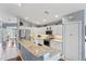Bright kitchen features granite counters, stainless appliances, and white cabinetry at 312 Barrington Ct, Spring Hill, FL 34609