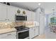 Well-appointed kitchen with stainless steel appliances and tiled backsplash at 312 Barrington Ct, Spring Hill, FL 34609