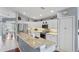 Modern kitchen with granite counters, stainless steel appliances, and eat-in bar at 312 Barrington Ct, Spring Hill, FL 34609