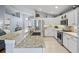 Spacious kitchen with granite countertops, stainless steel appliances, and white cabinetry at 312 Barrington Ct, Spring Hill, FL 34609