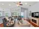Spacious living room with vaulted ceilings, wood floors and ample seating for entertaining at 312 Barrington Ct, Spring Hill, FL 34609