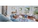 Inviting living room features hardwood floors, lots of natural light, and stylish decor at 312 Barrington Ct, Spring Hill, FL 34609