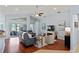 Cozy living room boasts wood floors, neutral paint, vaulted ceilings and comfortable seating at 312 Barrington Ct, Spring Hill, FL 34609