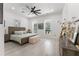 Bright bedroom features a ceiling fan, two windows, and decor at 3431 Saturn Rd, Brooksville, FL 34604