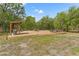 Spacious outdoor deck with grilling area, picnic table, and lounge, ideal for entertaining in a natural setting at 3431 Saturn Rd, Brooksville, FL 34604