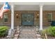 Grand brick home entrance with stately columns and double doors, exuding curb appeal at 3431 Saturn Rd, Brooksville, FL 34604