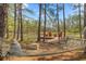 Relaxing lakeside view with a hammock and wooden dock, offering a serene outdoor experience at 3431 Saturn Rd, Brooksville, FL 34604