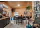 Multi-purpose hobby room with plywood walls, kitchenette, dining area, and storage at 3431 Saturn Rd, Brooksville, FL 34604