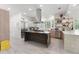 Spacious kitchen with a large island, stainless steel appliances, custom countertops, and ample cabinet space at 3431 Saturn Rd, Brooksville, FL 34604