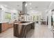 Spacious kitchen with a large marble island, wood cabinets, and an open layout at 3431 Saturn Rd, Brooksville, FL 34604