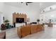 Open living room area with fireplace, clerestory windows, custom media wall, and seamless flow to the home's entrance at 3431 Saturn Rd, Brooksville, FL 34604