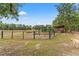 Spacious pasture with fencing, providing a secure area for livestock or horses to graze at 3431 Saturn Rd, Brooksville, FL 34604