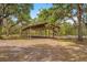Spacious pasture with an open-air covered arena, perfect for equestrian activities and livestock at 3431 Saturn Rd, Brooksville, FL 34604